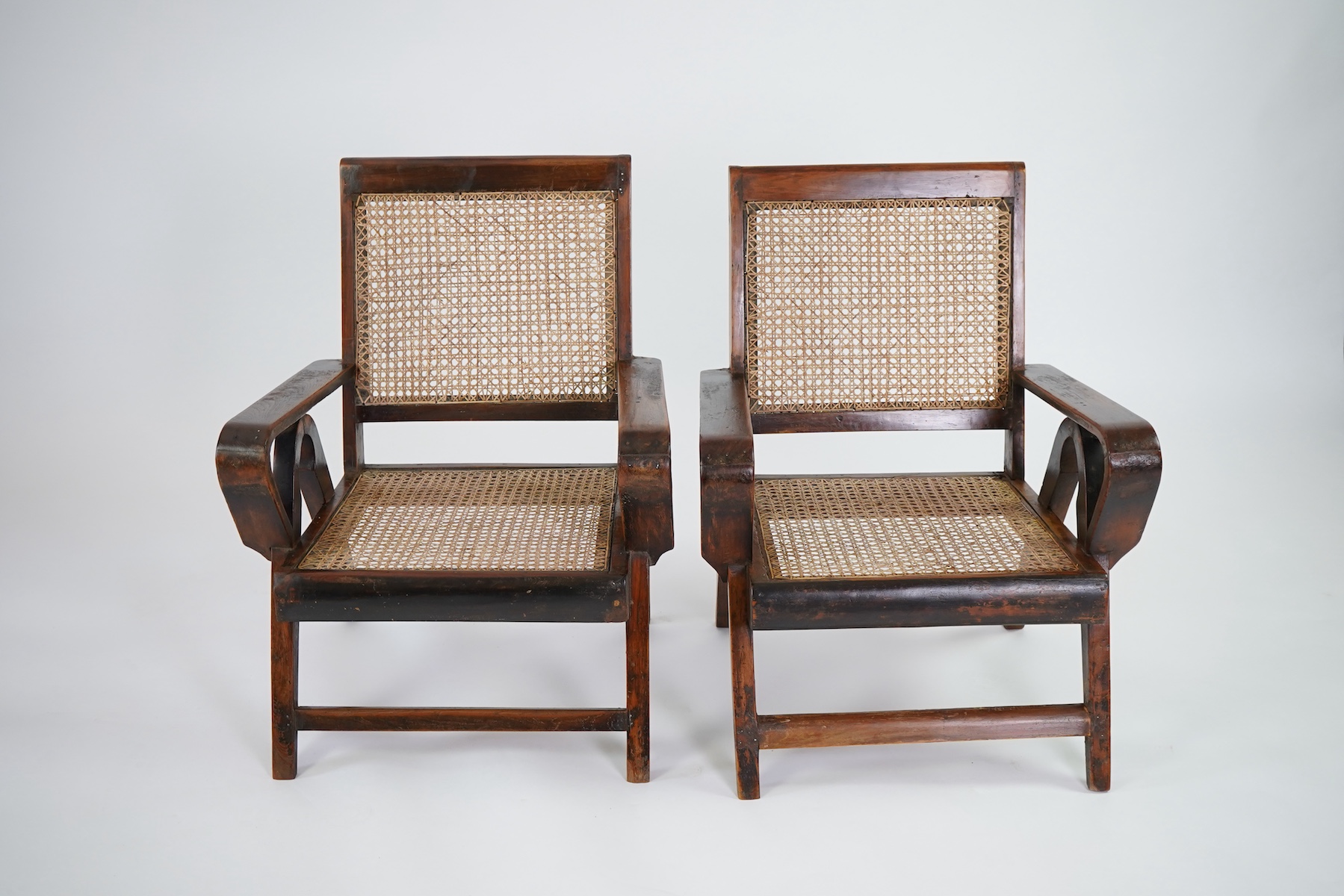 Pierre Jeanneret (Swiss, 1896-1967) for Chandigarh: A pair of teak armchairs PJ-010610